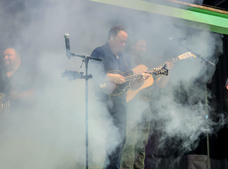 Jesse Brock with Authentic Unlimited engulfed with smoke at the 2026 Camp Springs Labor Blue Grass Festival - photo © Laura Tate Photography