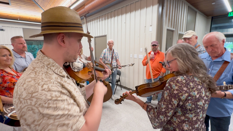 Left to right in background - Cindy Matheson, Mitch Meadors, (hidden on bass) Marsha Bosich, Buzz Matheson, Mick Martin, Brad Foust, and Radford Vance. Front & center - Fiddlin’ Ray Bruckman and Michele Birkby-Vance on twin fiddles at Bob Artis' 80th birthday celebration (7/26/26) - photo © Karen Artis