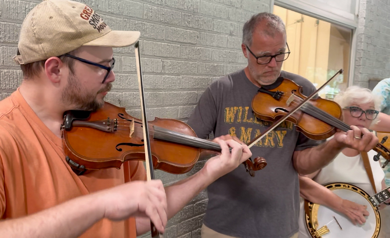 More twin fiddles - Jim McLaughlin and Jack Mackin, with Jack’s mom Wendy Mackin on banjo at Bob Artis' 80th birthday celebration (7/26/26) - photo © Karen Artis