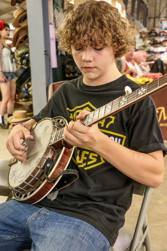 Alex Davis jamming at the 2026 Walnut Valley Festival - photo © G. Nicholas Hancock