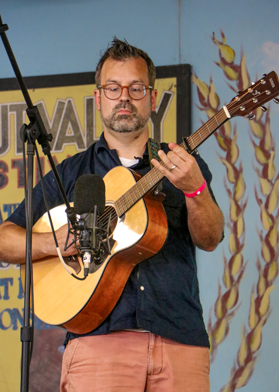 Andy Hatfield in the National Flat Pick Guitar competition at the 2026 Walnut Valley Festival - photo © G. Nicholas Hancock