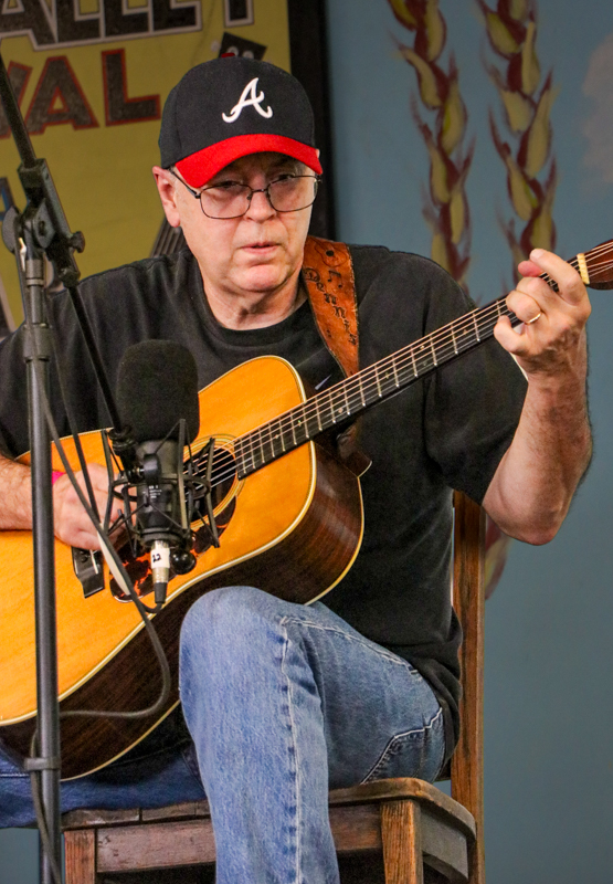 Dennis Wagner in the National Flat Pick Guitar competition at the 2026 Walnut Valley Festival - photo © G. Nicholas Hancock