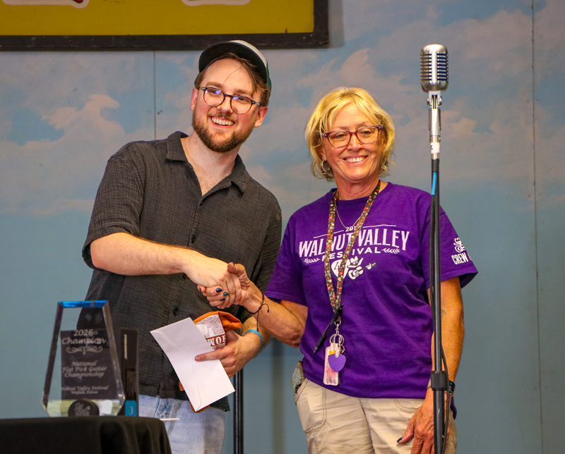 Dillon Hodges and Festival Director Kathy Rogers at the 2026 Walnut Valley Festival - photo © G. Nicholas Hancock