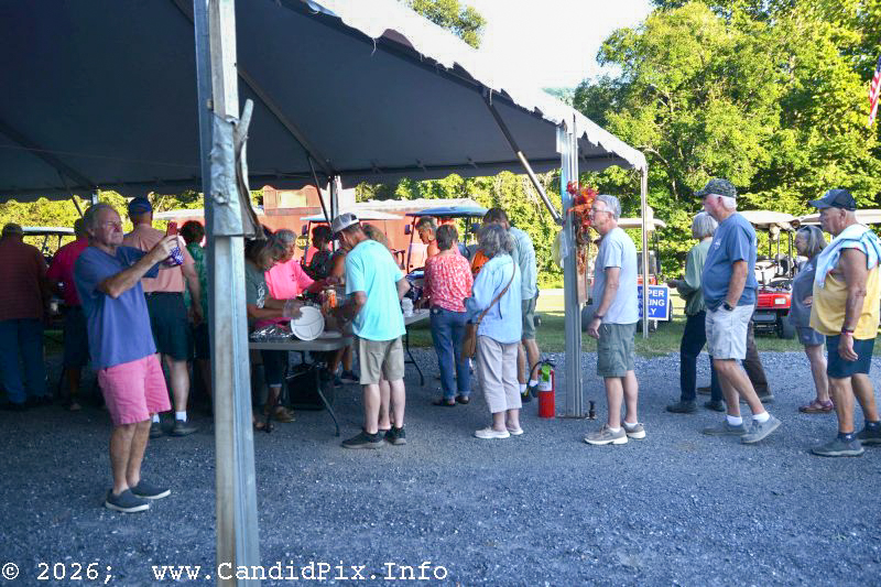 Lining up for a pot luck dinners at the 2026 Nothin' Fancy Bluegrass Festival - photo © Bill Warren