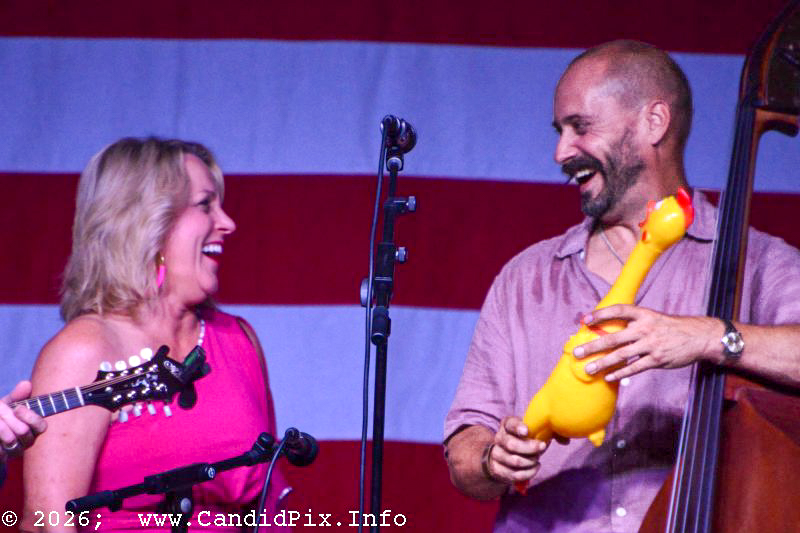 Rhonda Vincent presents Jenkins with a rubber chicken at the 2026 Nothin' Fancy Bluegrass Festival - photo © Bill Warren