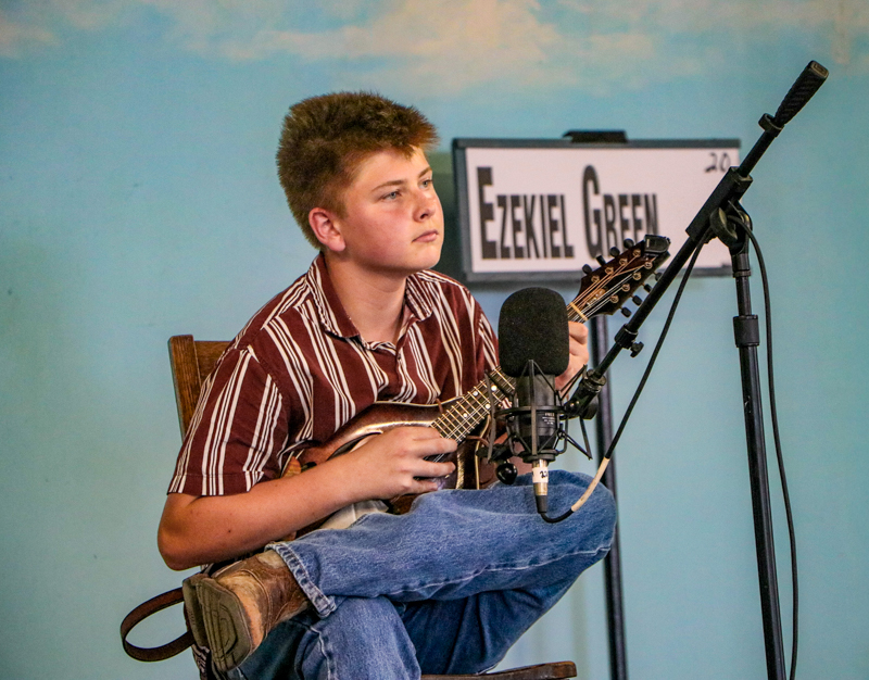 Ezekiel Green in the mandolin competition at the 2026 Walnut Valley Festival - photo © G. Nicholas Hancock