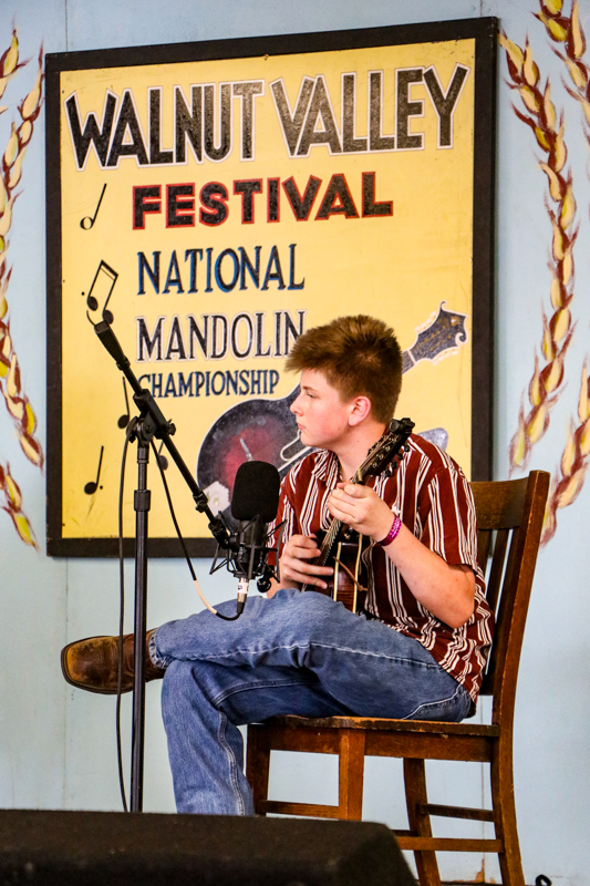 Ezekiel Green in the mandolin competition at the 2026 Walnut Valley Festival - photo © G. Nicholas Hancock