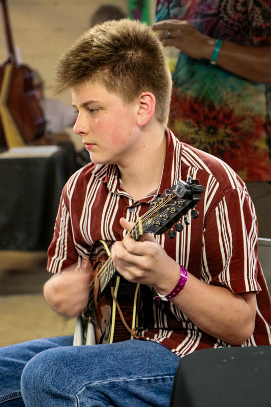 Ezekiel Green jamming at the 2026 Walnut Valley Festival - photo © G. Nicholas Hancock