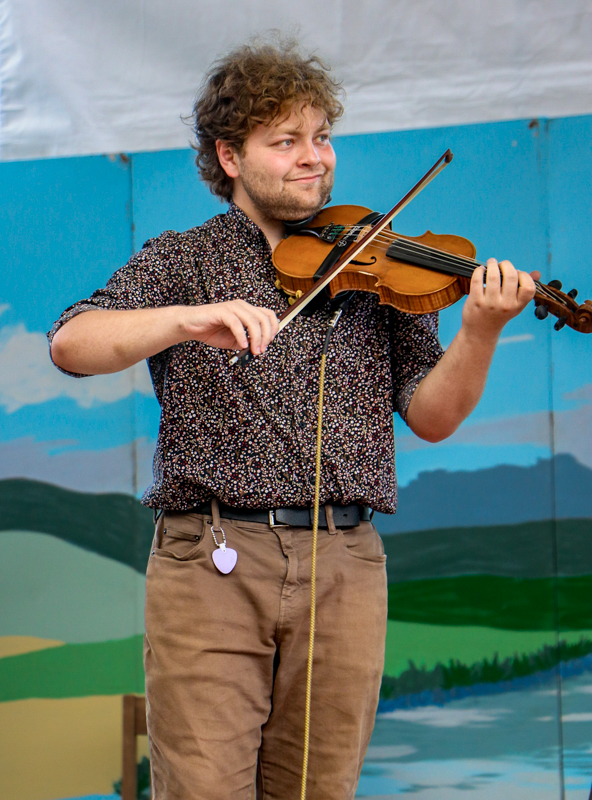 Jackson Earles with The Cody Sisters at the 2026 Walnut Valley Festival - photo © G. Nicholas Hancock.jpg