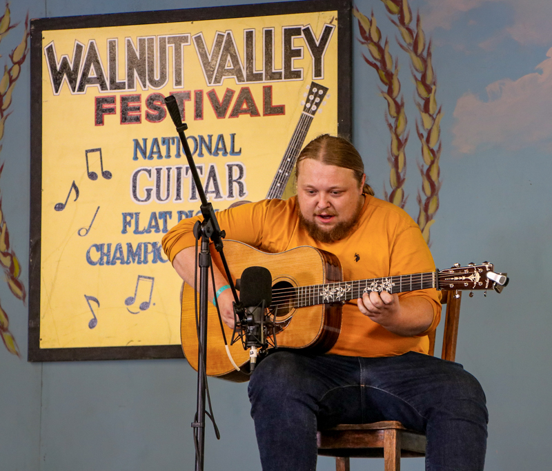 Jakob Thomas in the National Flat Pick Guitar competition at the 2026 Walnut Valley Festival - photo © G. Nicholas Hancock