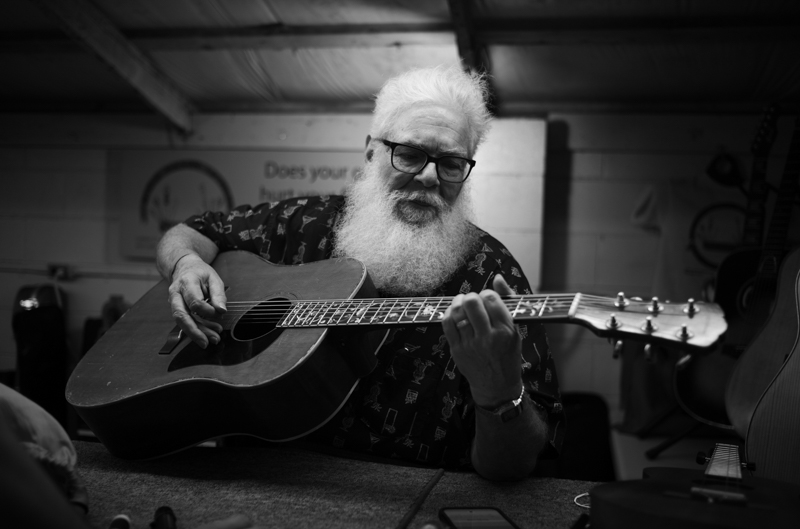 Steve Mason, luthier, checking out a prototype Mossman guitar, 54th Annual Walnut Valley Festival, Wednesday, September 17th, 2026. Winfield, Kansas. Photo by Jeromie Stephens © 2026