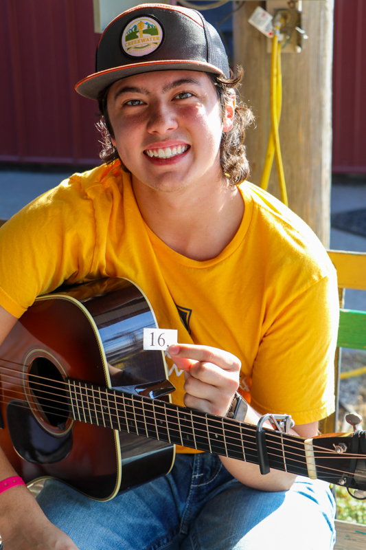 JonPaul Sepulveda drew number 16 as his playing position in the National Flat Pick Guitar competition at the 2026 Walnut Valley Festival - photo © G. Nicholas Hancock