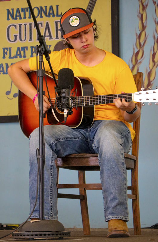 JonPaul Sepulveda in the National Flat Pick Guitar competition at the 2026 Walnut Valley Festival - photo © G. Nicholas Hancock
