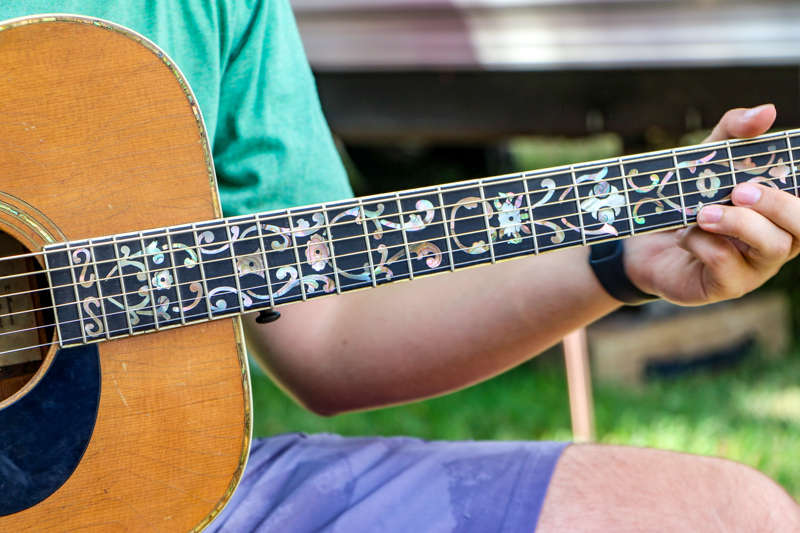 JonPaul Sepulveda playing the S. L. Mossman Proto 012 at the 2026 Walnut Valley Festival - photo © G. Nicholas Hancock