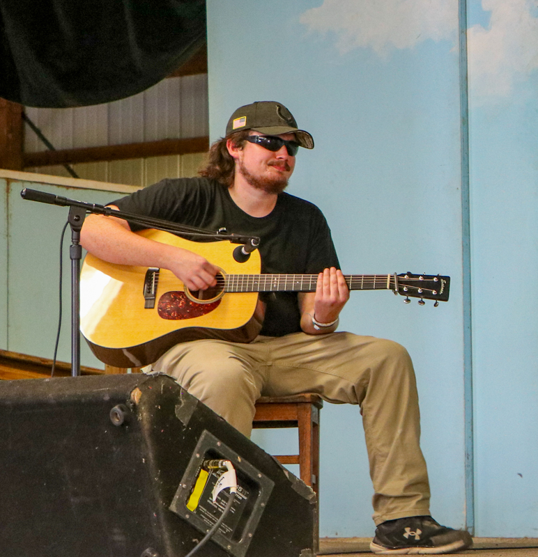 Luke Lovejoy playing backup at the 2026 Walnut Valley Festival - photo © G. Nicholas Hancock
