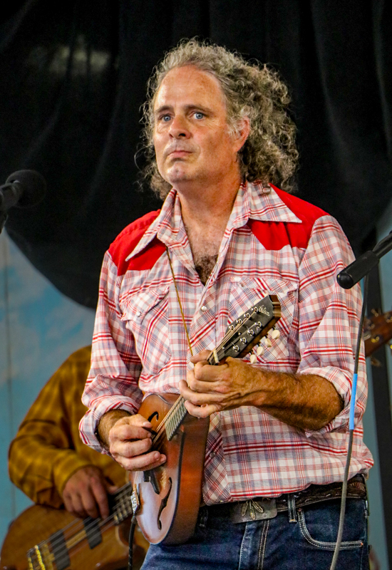 Mark Schimick with Songs From The Road Band at the 2026 Walnut Valley Festival - photo © G. Nicholas Hancock