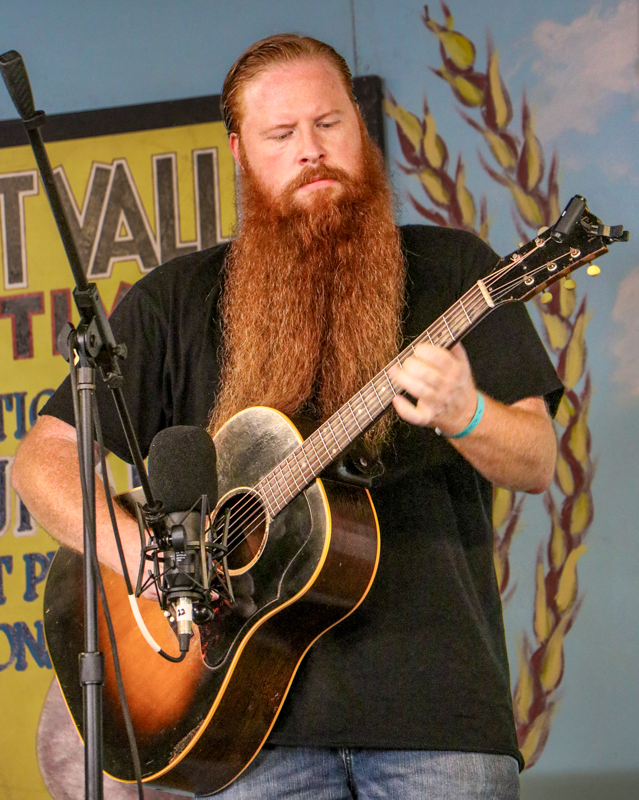 Nick Norris in the National Flat Pick Guitar competition at the 2026 Walnut Valley Festival - photo © G. Nicholas Hancock