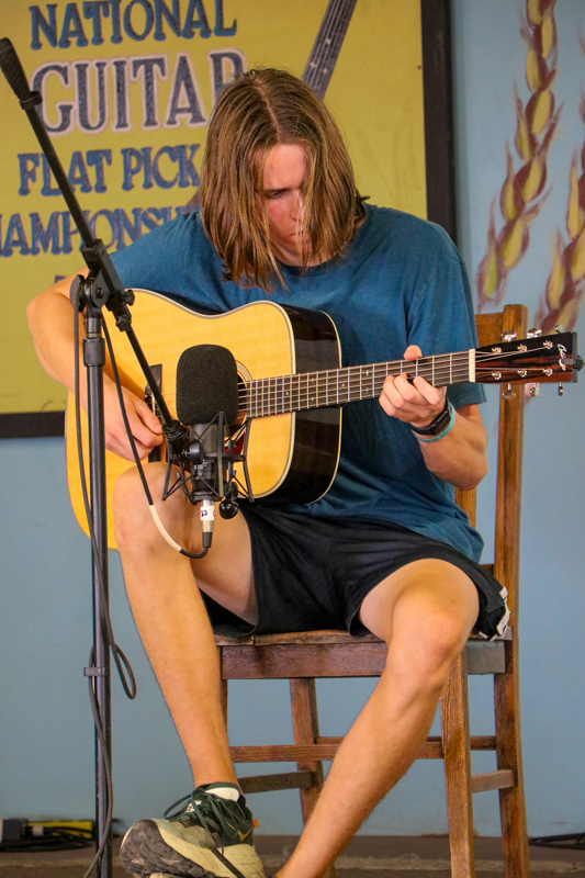 Oscar Caudell in the National Flat Pick Guitar Championship at the 2026 Walnut Valley Festival - photo © G. Nicholas Hancock