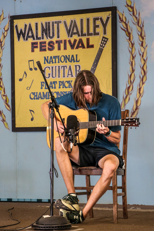 Oscar Caudell in the National Flat Pick Guitar competition at the 2026 Walnut Valley Festival - photo © G. Nicholas Hancock