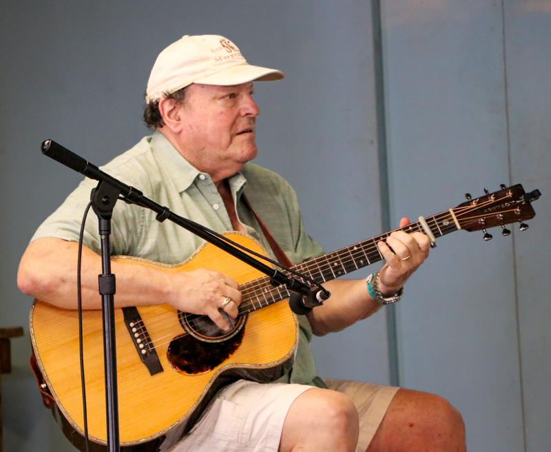 Steve Kaufman playing backup in the National Flat Pick Guitar competition at the 2026 Walnut Valley Festival - photo © G. Nicholas Hancock