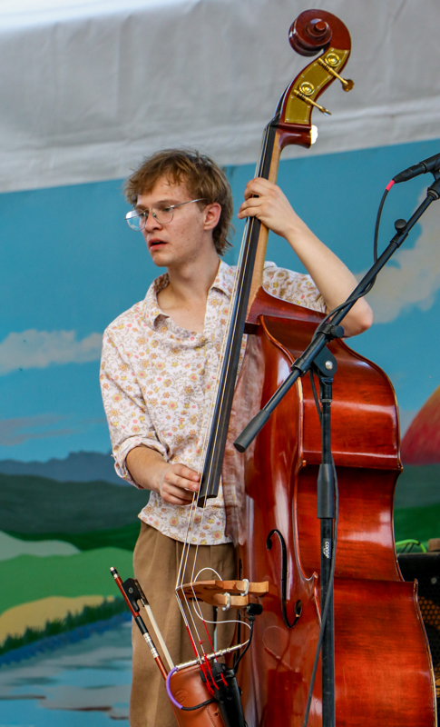 Will Pavilonis with The Cody Sisters at the 2026 Walnut Valley Festival - photo © G. Nicholas Hancock