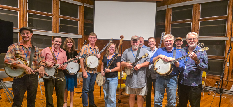 Night of the Living Banjo presenters, L:R Rex McGee, Tyler Hughes, Brett Morris, Lincoln Hensley, Marsha Todd, Joey Burris, Jesse Morris, Jeremy Stephens, Jim Lloyd, Will Eller, and Dale Morris at the 2026 JAM retreat