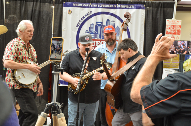 Jamming with Frank Solivan & Dirty Kitchen in the Exhibit Hall at World of Bluegrass '26 - photo © Roger Black