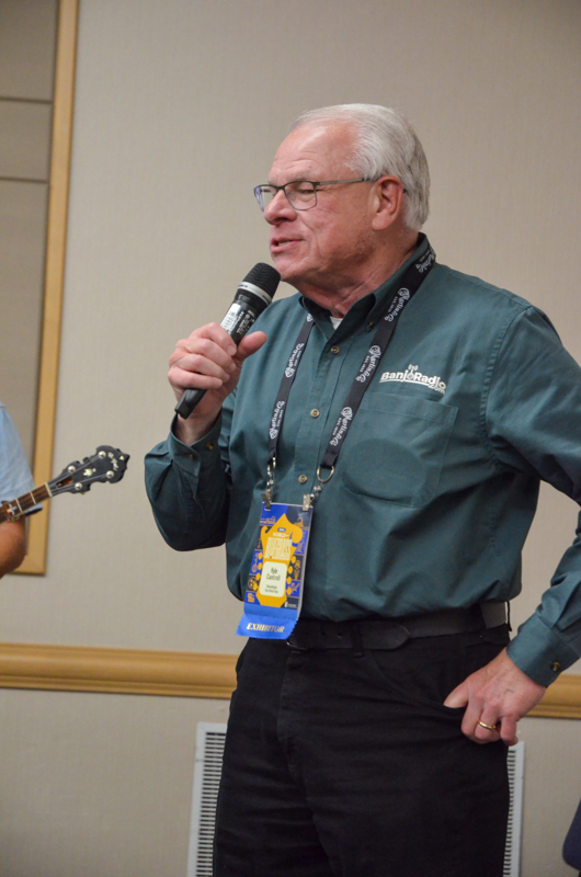 Kyle Cantrell MCs a showcase at World of Bluegrass '26 - photo © Roger Black