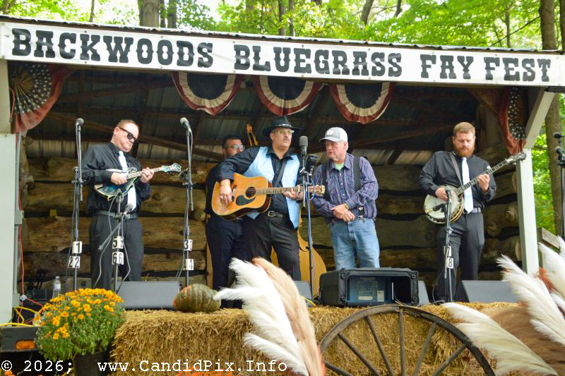 Kevin Parter joins Tracy Evans & Riverbend at the 2026 Backwoods Bluegrass Fay Fest - photo © Bill Warren