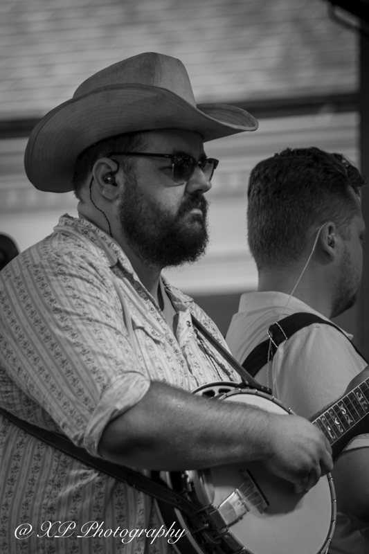 Cody Looper with Jason Carter & Michael Cleveland at Bluegrass & Brew '26 in Fairborn, OH - photo © Xavier Prenatt