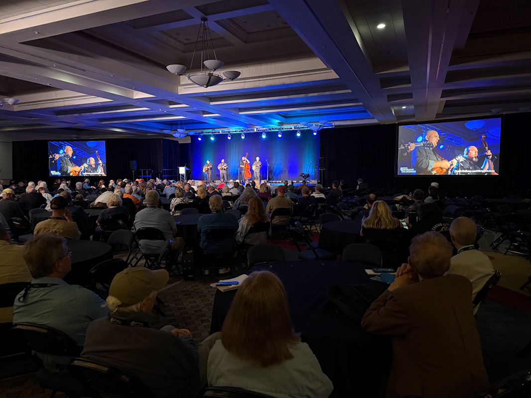 Frank Solivan & Dirty Kitchen perform before Tim Stafford’s keynote speech at World of Bluegrass '26. Professional sound, lights, and video make it easy to see and hear, even from the back of the room, and the ballroom was large and comfortable - photo © Elizabeth Loring