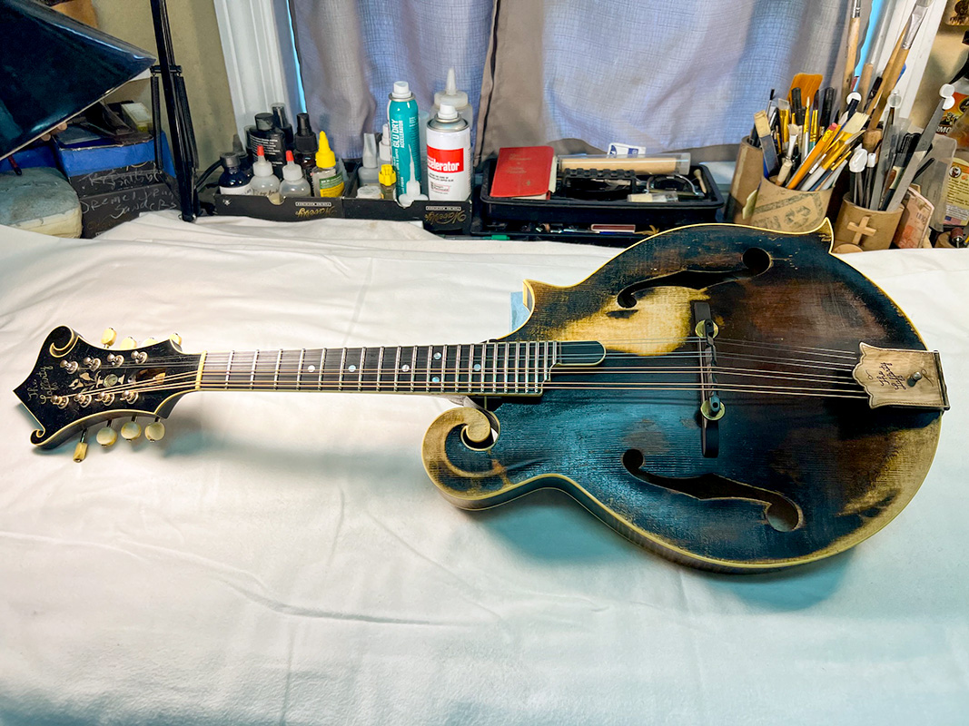 Lafferty Mad Mon model mandolin being distressed by David Harvey