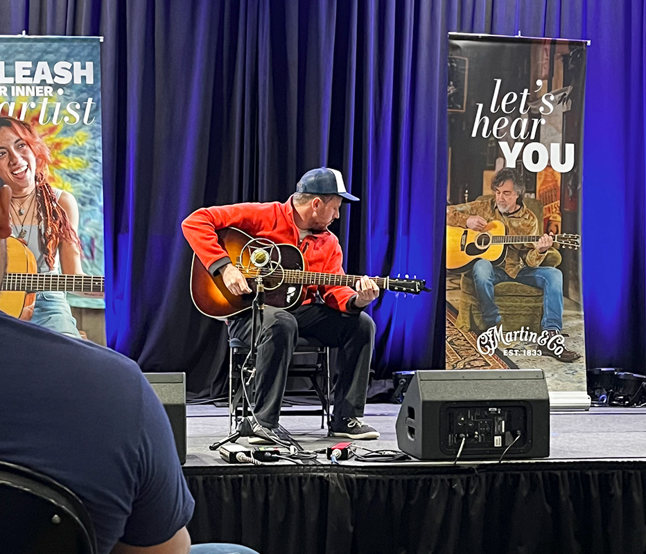 Jed Clark competing in the Martin Guitar Picking for the Prize guitar contest during World of Bluegrass 2026 - photo © Isabella Trakimowicz