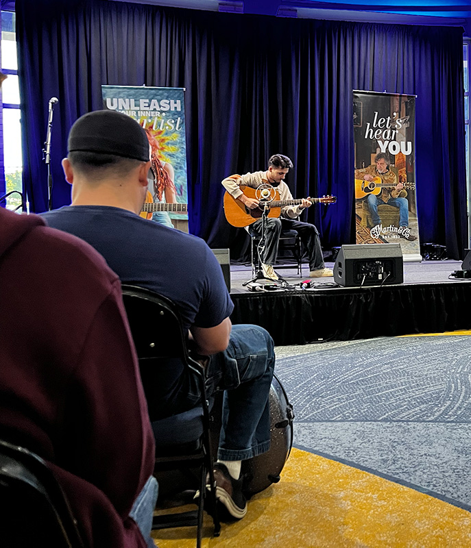 Teak Porter competing in the Martin Guitar Picking for the Prize guitar contest during World of Bluegrass 2026 - photo © Isabella Trakimowicz
