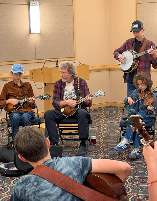 Sam Bush jamming with Kids on Bluegrass participants at World of Bluegrass '26 - photo © Amanda Schwartz