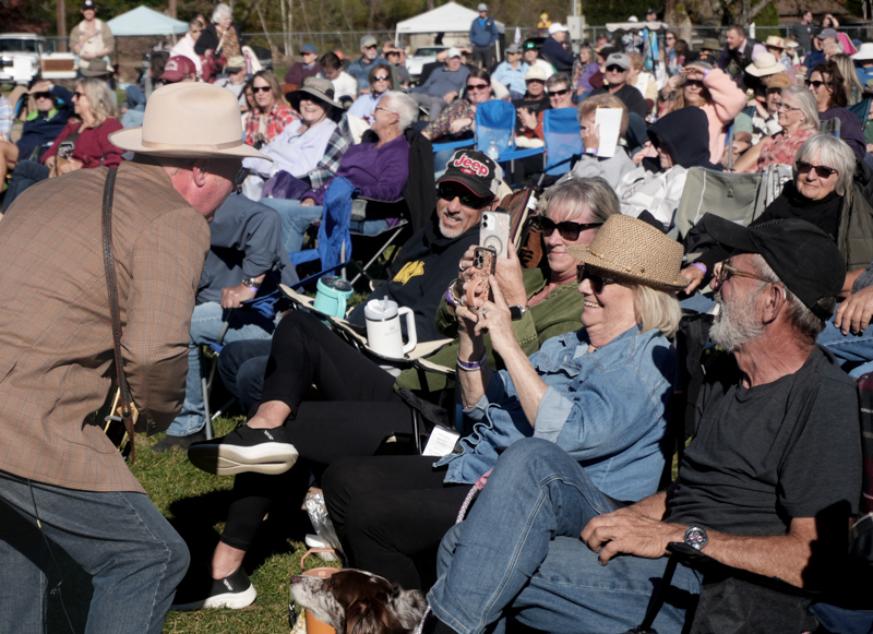 Darrell Webb with Appalachian Road Show goes into the audience at the 2026 Smoky Mountains Bluegrass Festival - photo © Jeff Lahr
